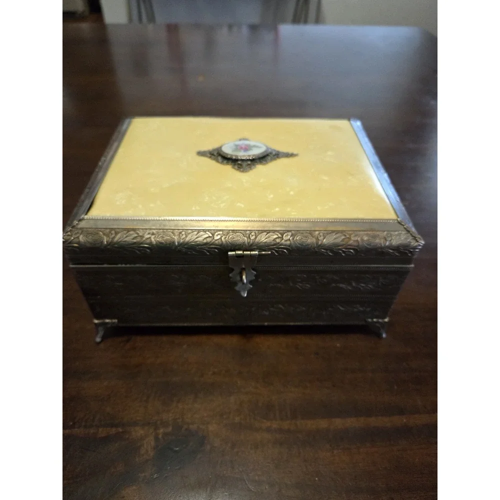 antique etched brass trinket box features a hinged lid Music Box